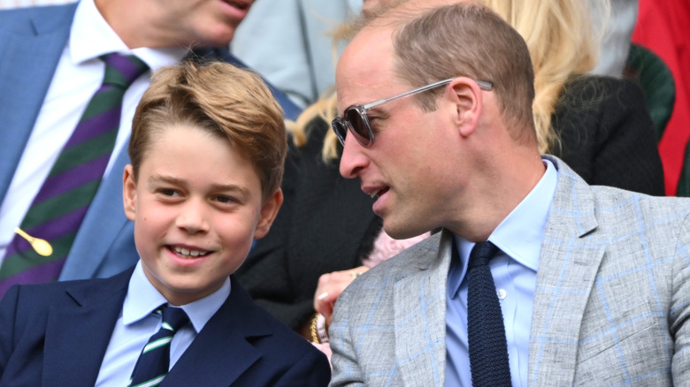 Prince George and Prince William at a sporting event