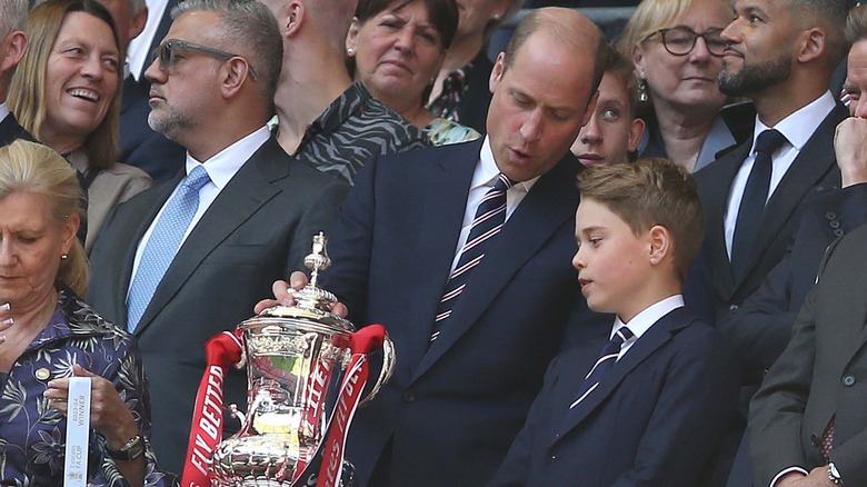 Prince William and Prince George in a crowd