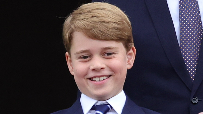 Prince George smiling blue and white striped tie