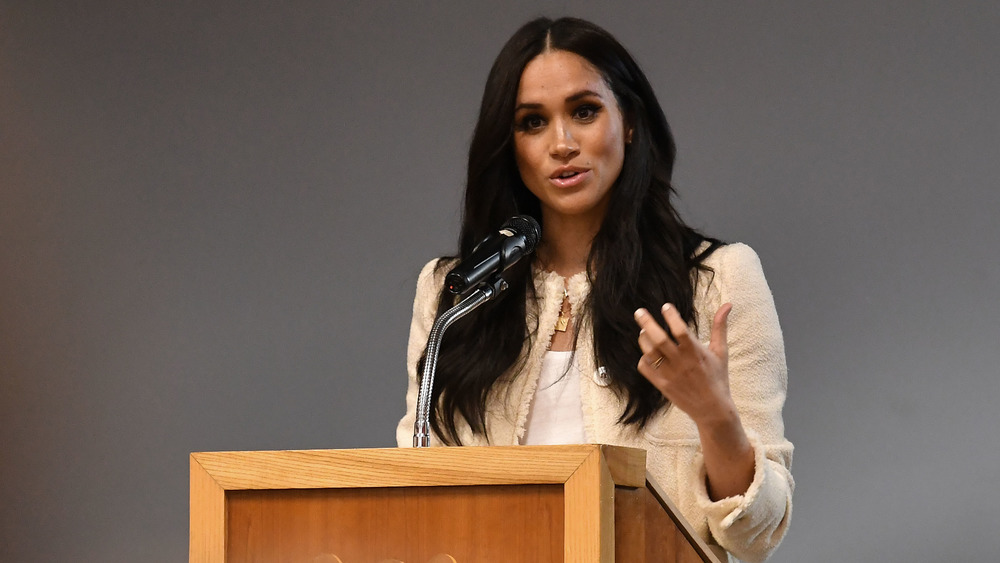 Meghan Markle speaking at a podium