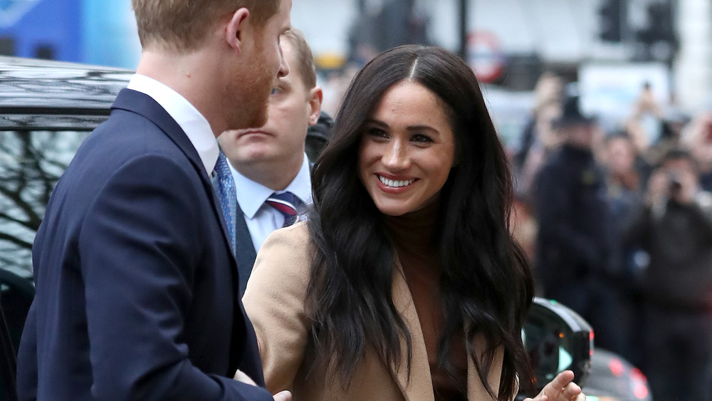 Meghan Markle smiling at Prince Harry