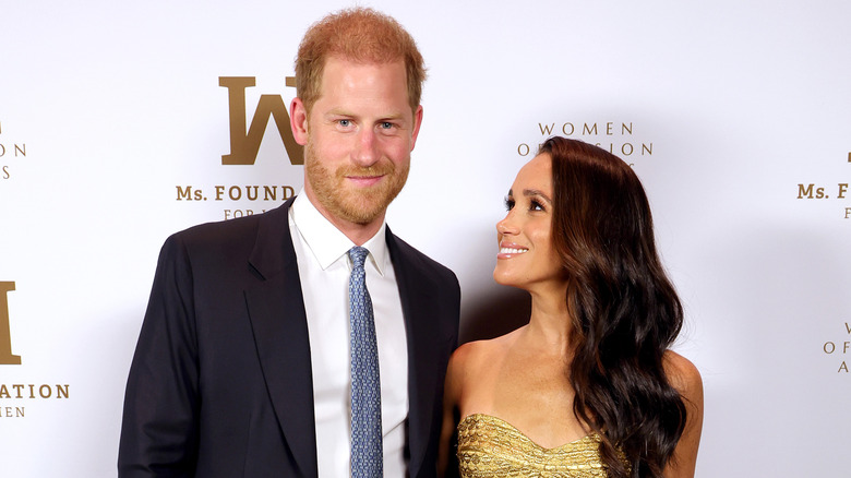 Prince Harry and Meghan Markle posing