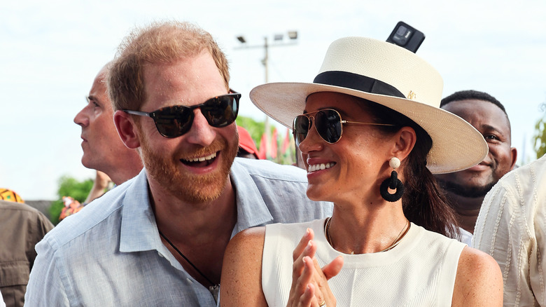 Prince Harry and Meghan Markle smiling