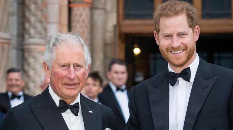 King Charles posing with Prince Harry 