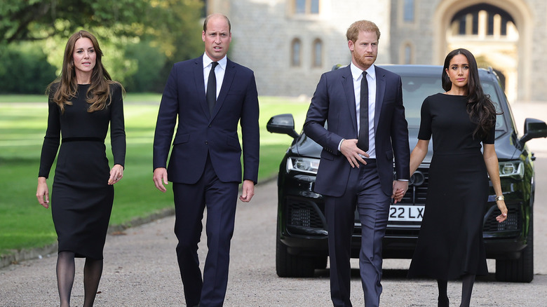 Princess Kate and Prince William walk with Prince Harry and Meghan Markle