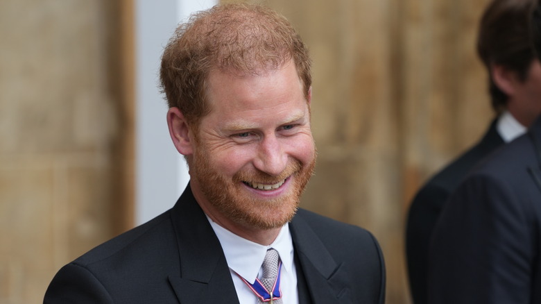 prince harry smiling in suit