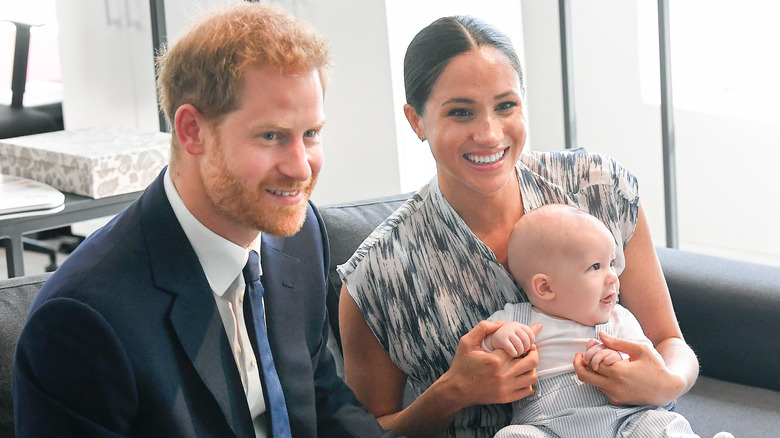 Prince Harry, Meghan Markle, and baby Prince Archie smiling