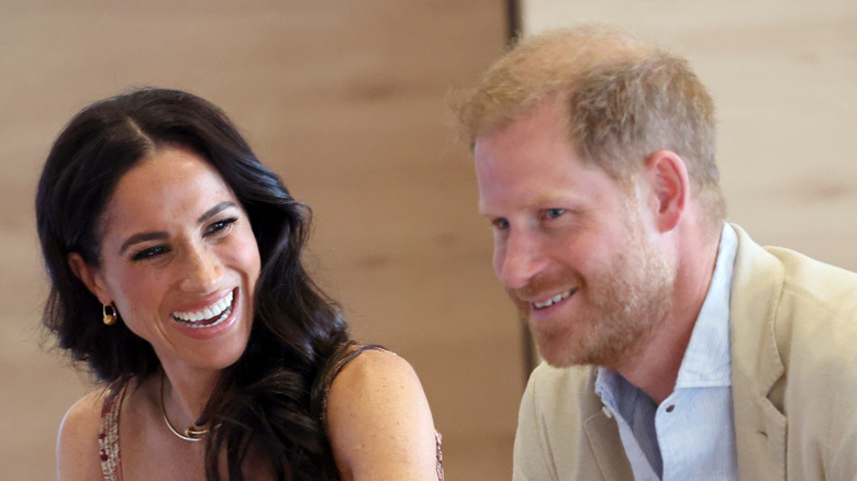 Prince Harry and Meghan Markle sharing a laugh