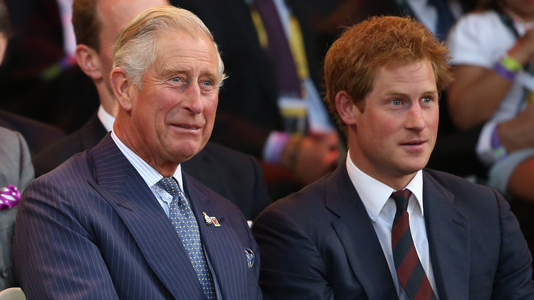 King Charles and Prince Harry looking surprised