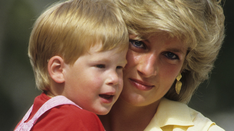 Princess Diana carrying young Prince Harry