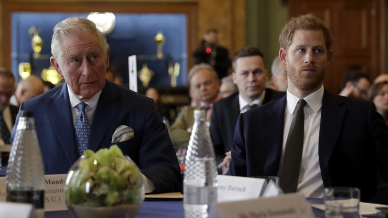 King Charles and Prince Harry looking grumpy