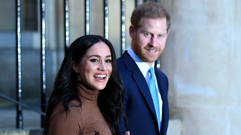 Harry and Meghan smiling