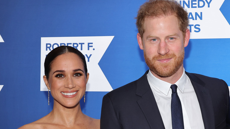 Harry and Meghan smiling