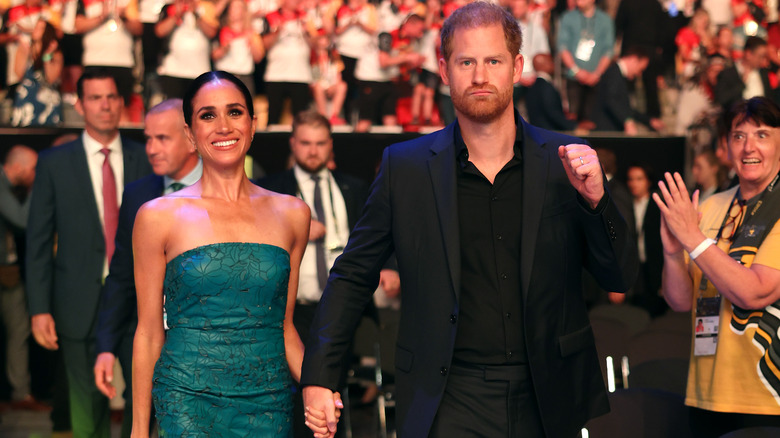 Meghan Markle green dress with Prince Harry Invictus Games