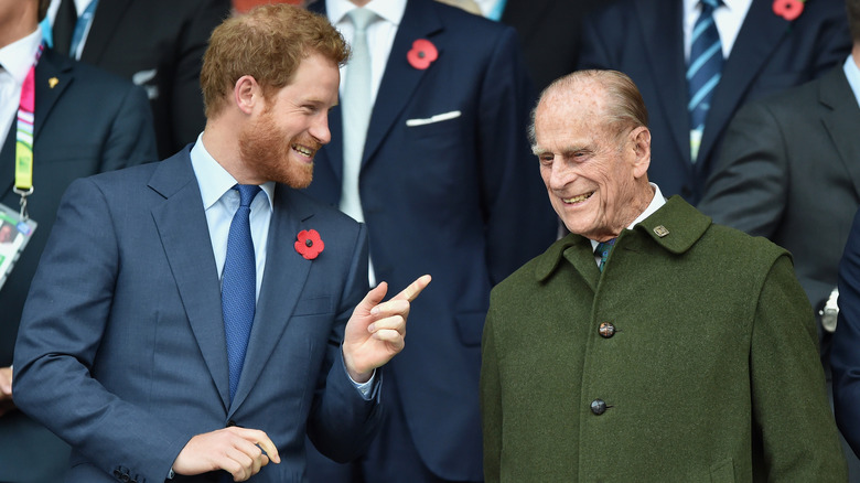 Prince Harry and Prince Philip smiling