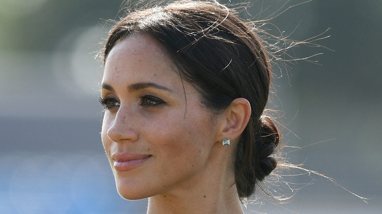 Meghan Markle softly smiling 