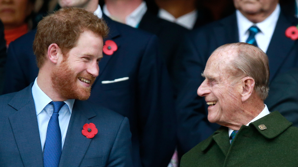 Prince Harry and Prince Philip laugh