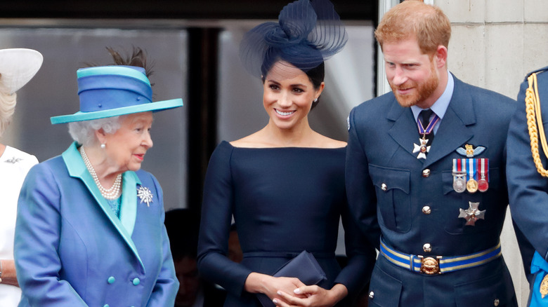 Prince Harry and Meghan Markle speaking with The Queen