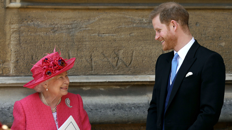 Prince Harry and the Queen laughing together 