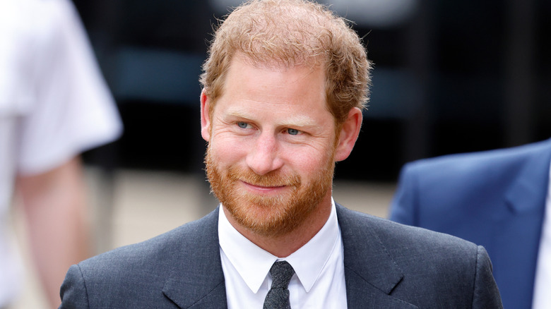 Prince Harry smirking.