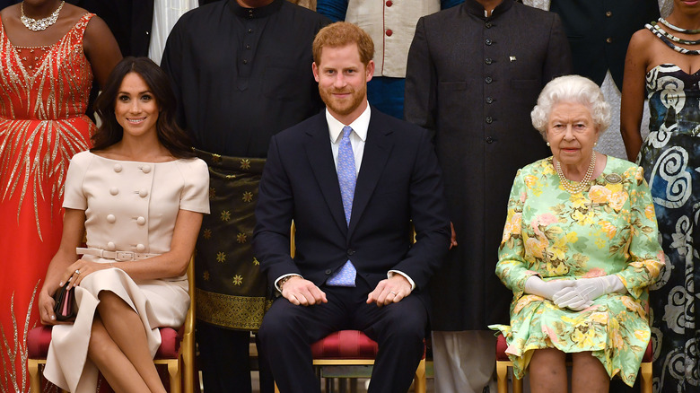 Meghan Markle, Prince Harry, and Queen Elizabeth sitting together