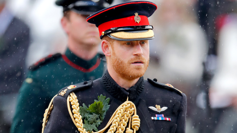 Prince Harry with serious expression in military uniform