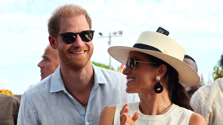 Prince Harry and Meghan Markle smiling