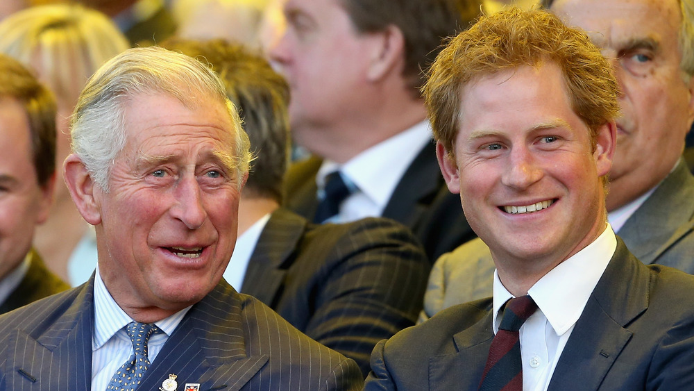 Prince Charles and Prince Harry smiling