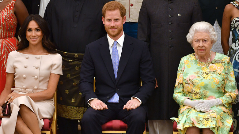 Meghan Markle. Prince Harry and Queen Elizabeth II at the Queen's Young Leaders Awards Ceremony 