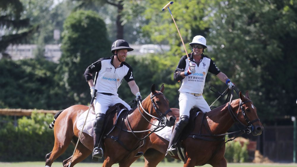 Harry and Nacho Figueras playing polo