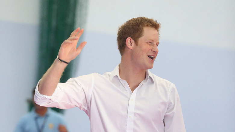 Prince Harry waving and laughing