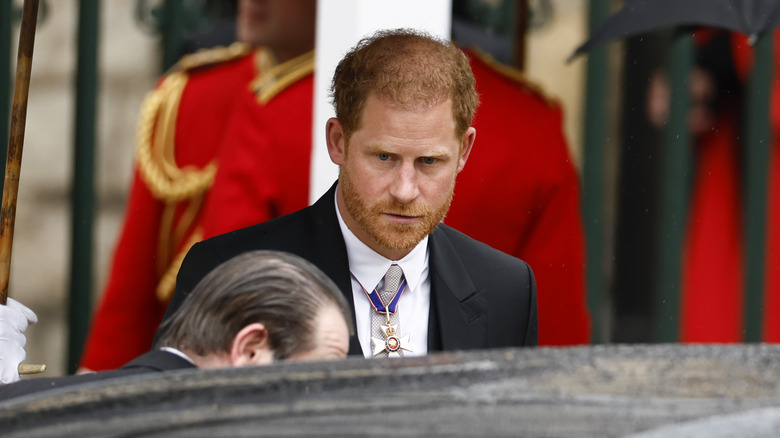 Prince Harry entering royal car