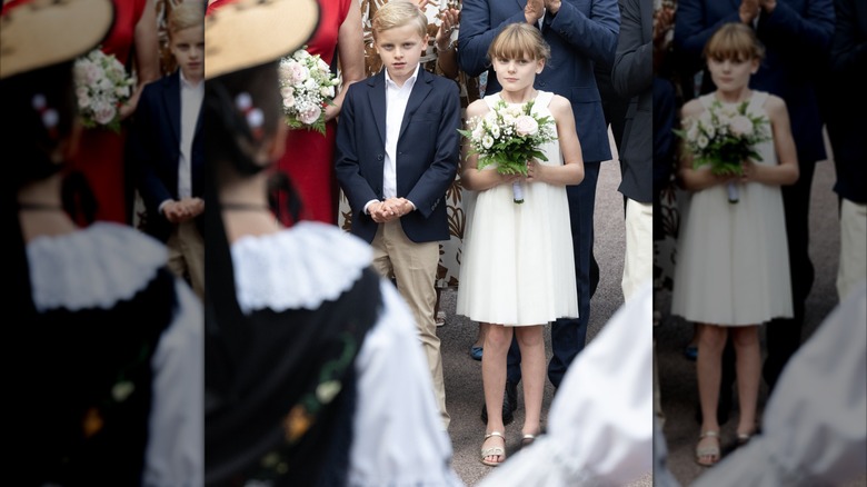 Princess Gabriella and Prince Jacques pose with flowers