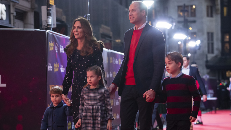 The Cambridges walking together at event