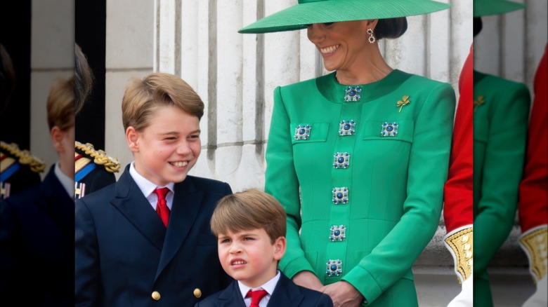 Kate Middleton and sons George and Louis smiling at flypast