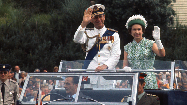 Prince Philip and Queen Elizabeth in a landrover