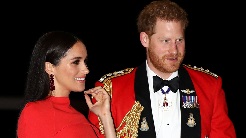 Harry and Meghan in red formal attire