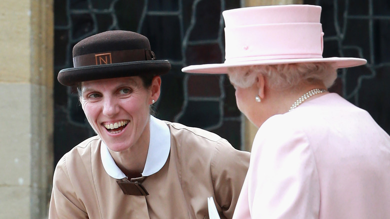 Maria Borallo smiling with Queen Elizabeth