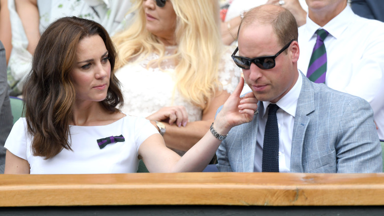 Princess Catherine rubbing Prince William's cheek at Wimbledon