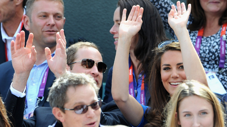 Prince William & Princess Catherine raising arms at Wimbledon