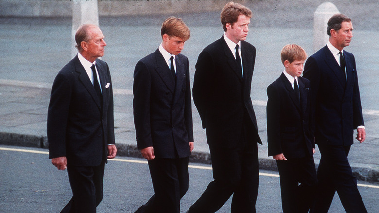 Family walks behind Diana's casket