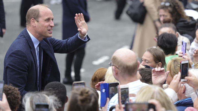 Prince William waving at crowds in Wales