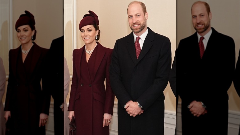 Prince William and Kate Middleton in outdoor coats, standing next to each other but not interacting, with seemingly fake smiles.