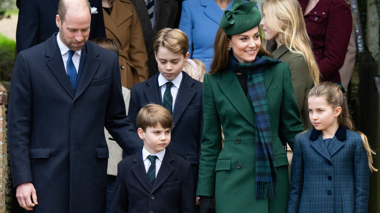 William and Catherine, Prince and Princess of Wales,stand with their children, George, Charlotte and Louis