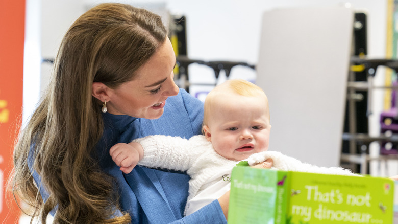 Kate Middleton cuddling a baby