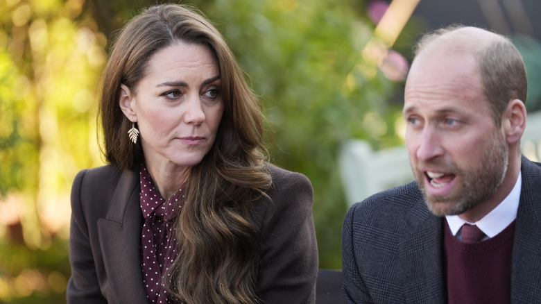 Princess Kate listening to Prince William as he speaks to members of the Emergency Services