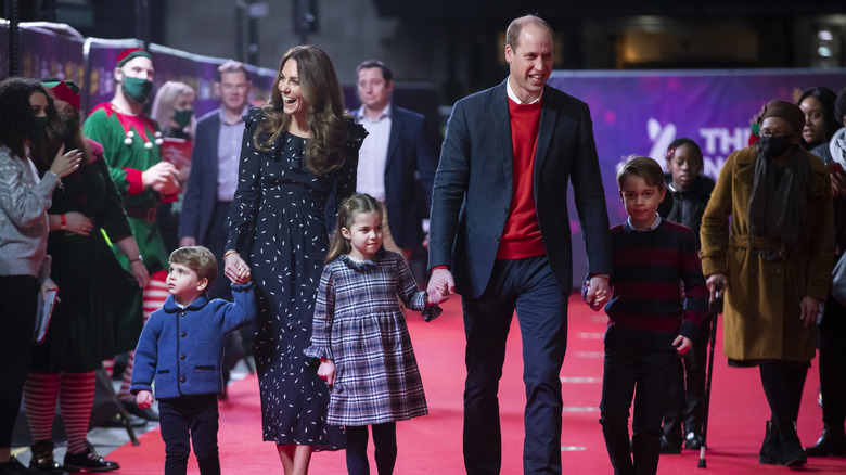 Prince William and Kate Middleton at an event with their children