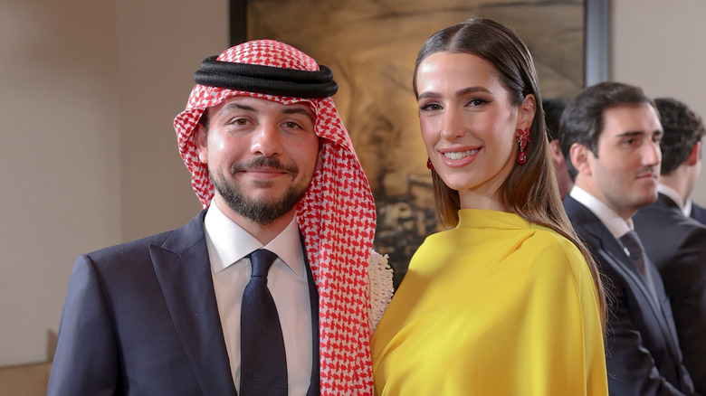 Crown Prince Hussein and Princess Rajwa smiling