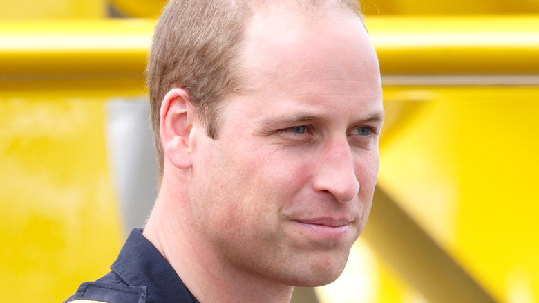 Prince William outside, smiling