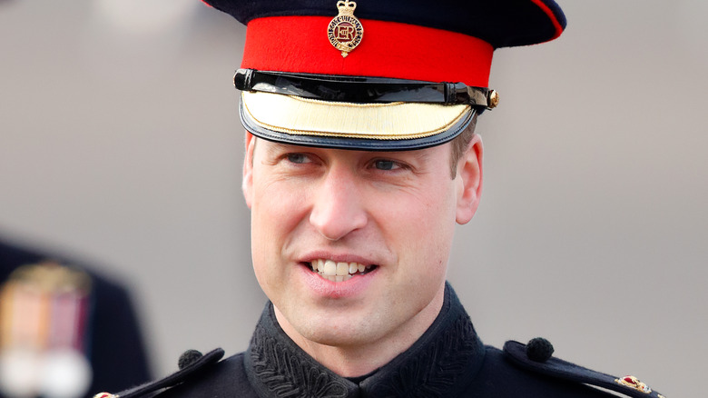 Prince William in military outfit, looking away